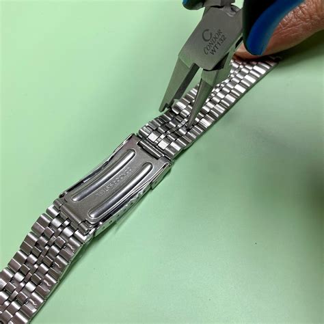 how to add links to watch|adjust a metal watch band.